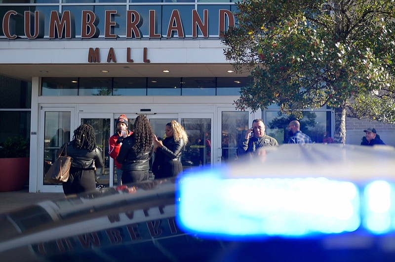 Bystanders wait outside as authorities investigate an incident at Cumberland Mall in Smyrna, Ga., on Saturday, Dec. 14, 2019. (AP Photo/Mike Stewart)


