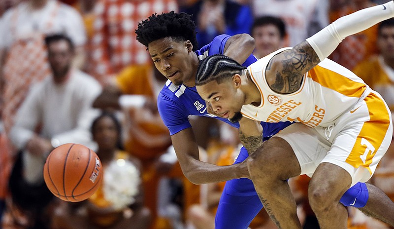 Tennessee's Lamonte Turner, right, battles for a loose ball with Memphis guard Jayden Hardaway during the first half of Saturday's game in Knoxville. / AP photo by Wade Payne