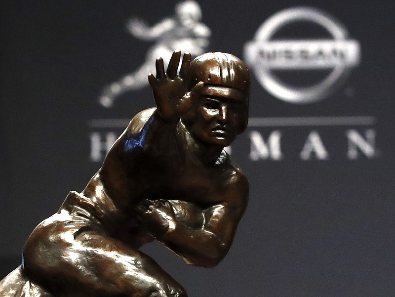 The Heisman Trophy is displayed during a news conference before the ceremony announcing the 2019 winner Saturday night in New York. / AP photo by Jason Szenes