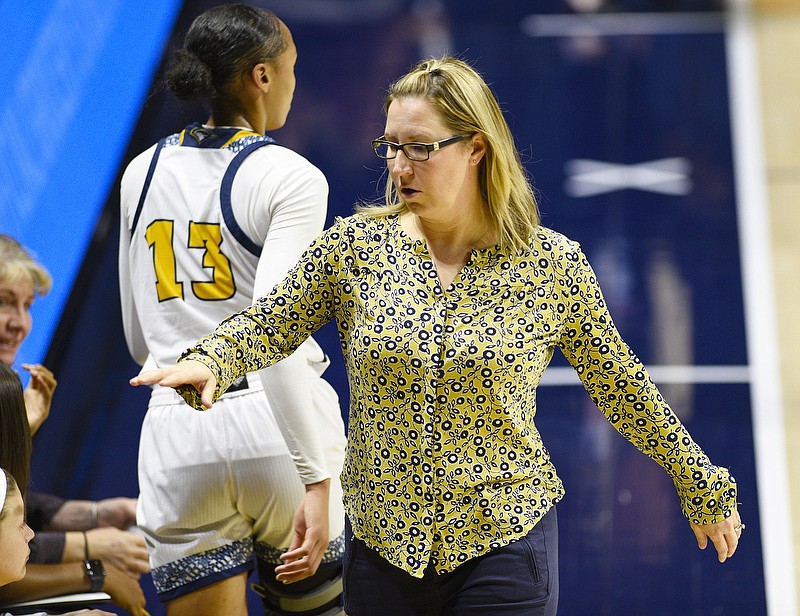 UTC women's basketball coach Katie Burrows goes to her bench for substitutions during Sunday's home game against Troy. / Staff photo by Robin Rudd  