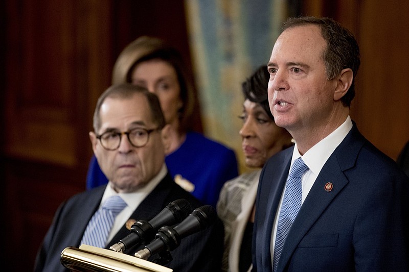 Rep. Adam Schiff, D-Calif., Chairman of the House Intelligence Committee, right, speaks with from left Chairman of the House Judiciary Committee Jerrold Nadler, D-N.Y., House Speaker Nancy Pelosi and Chairwoman of the House Financial Services Committee Maxine Waters, D-Calif., second from right, during a news conference to unveil articles of impeachment against President Donald Trump, abuse of power and obstruction of Congress, Tuesday, Dec. 10, 2019, on Capitol Hill in Washington. (AP Photo/Andrew Harnik)

