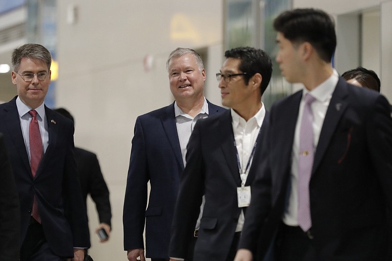 U.S. Special Representative for North Korea Stephen Biegun, center, arrives at Incheon International Airport in Incheon, South Korea, Sunday, Dec. 15, 2019. Biegun arrived in the country on the first leg of his two-stop Asia trip and will meet his counterparts in South Korea and Japan. (AP Photo/Lee Jin-man)