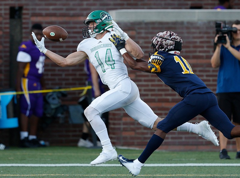 Staff photo / East Hamilton's Cade Meeks catches a touchdown pass ahead of Chattanooga Christian's Damarcus Hinton during the Times Free Press Best of Preps jamboree on Aug. 16, 2019, at Finley Stadium.