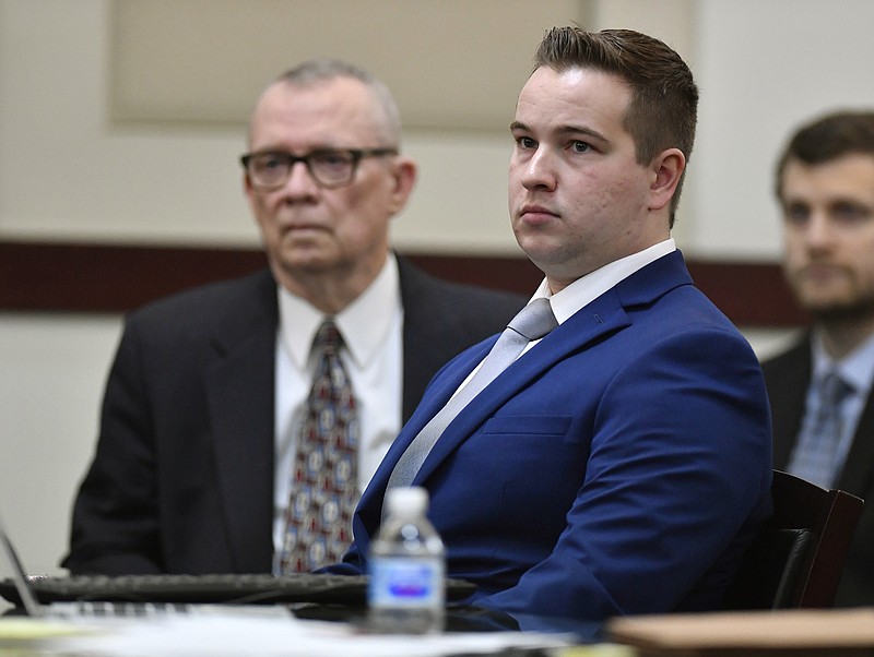 FILE - In this Jan. 5, 2019 file photo, Nashville Police Officer Andrew Delke sits with his attorney John M.L. Brown at the second day of his preliminary hearing at the Justice A.A. Birch Building in Nashville, Tenn. Delke, charged with fatally shooting an armed black man from behind, is appealing after a judge denied his request to draw the jury from outside the area. In Davidson County Criminal Court on Monday, Dec. 16 defense attorney David Raybin said his client shouldn't have to contend with the publicity that the July 2018 fatal shooting of 25-year-old Daniel Hambrick has received. (George Walker IV/The Tennessean via AP, File)

