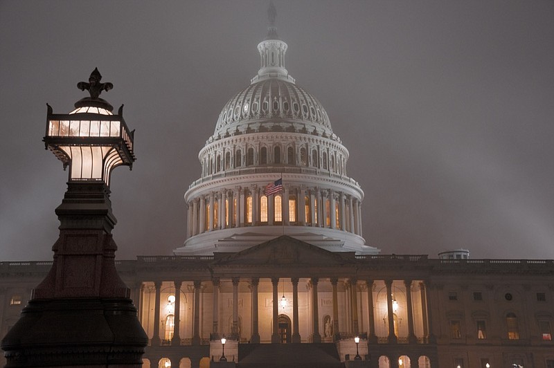 The U.S. Capitol in Washington is shrouded in mist, Friday night, Dec. 13, 2019, at the end of an acrimonious week of partisan rhetoric in the House Judiciary Committee which approved two articles of impeachment against President Donald Trump, Friday, Dec. 13, 2019. The full House of Representatives, controlled by the Democrats, is expected to vote on the charges of abuse of power and obstruction of Congress before lawmakers depart for the holidays. (AP Photo/J. Scott Applewhite)   