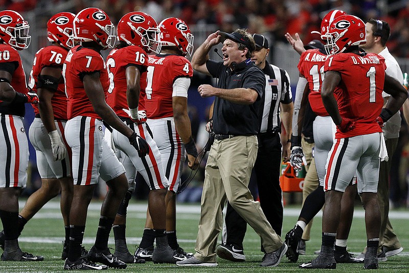 Georgia football coach Kirby Smart yells at his defense during the SEC title game against LSU on Dec. 7 at Mercedes-Benz Stadium in Atlanta. / Staff photo by C.B. Schmelter