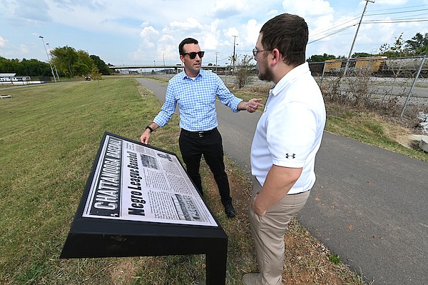 Photo courtesy of UTC / Mike Thompson and Nate Collyer view one of five new markers detailing Chattanooga's baseball history.
