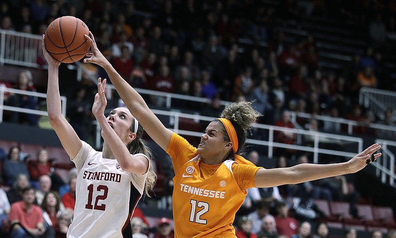 Stanford's Lexie Hull drives to the basket past Tennessee's Rae Burrell during the second half of Wednesday night's game in California. No. 1 Stanford beat No. 23 Tennessee 78-51. / AP photo by Ben Margot