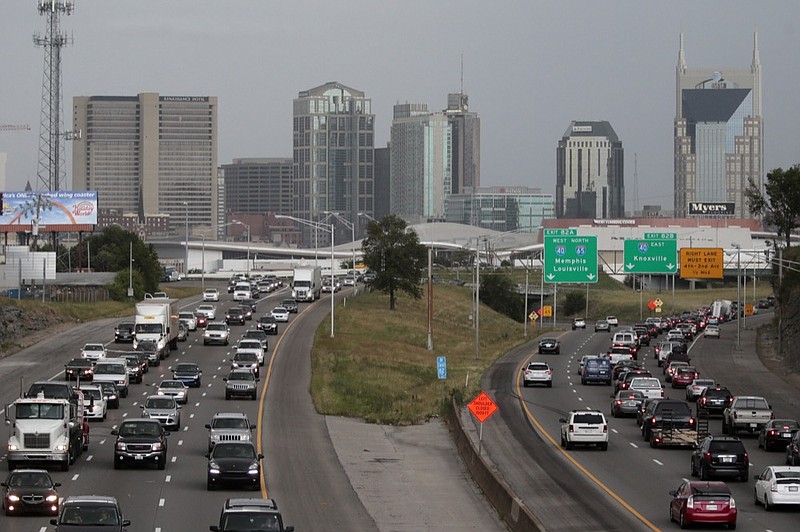 FILE- In this June 26, 2015, file photo, heavy traffic moves away from and toward the downtown area of Nashville, Tenn. (AP Photo/Mark Humphrey, File)


