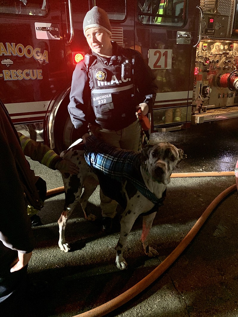 Chattanooga firefighters rescued a woman and her dog from a burning home Thursday night, Dec. 19, 2019, in East Brainerd. / Photo from Lindsey Rogers/Chattanooga Fire Department