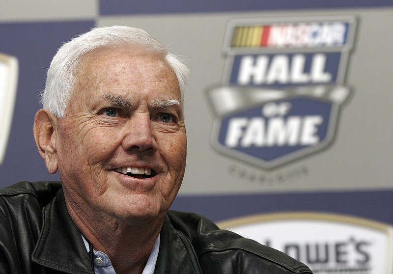 Former NASCAR driver and owner Junior Johnson smiles as he speaks to media about being named to the NASCAR Hall of Fame during a news conference at Lowe's Motor Speedway on Oct. 16, 2009, in Concord, N.C. Johnson, who won 50 NASCAR Cup Series races as a driver and 132 as an owner, died Friday at age 88. / AP photo by Bob Jordan