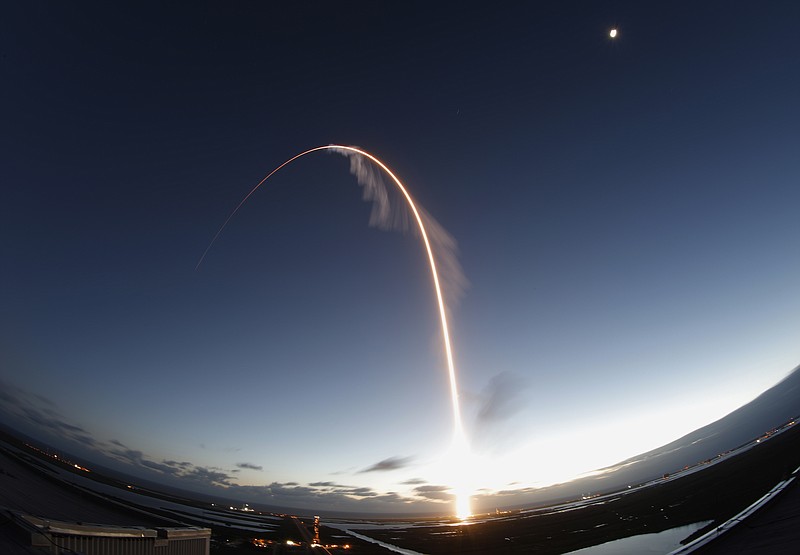 In this long exposure photo, the United Launch Alliance Atlas V rocket carrying the Boeing Starliner crew capsule lifts off on an orbital flight test to the International Space Station from Space Launch Complex 41 at Cape Canaveral Air Force station, Friday, Dec. 20, 2019, in Cape Canaveral, Fla. (AP Photo/Terry Renna)