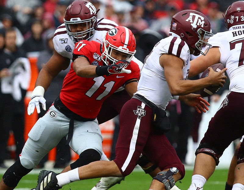 Georgia junior outside linebacker Jermaine Johnson closes in on Texas A&M quarterback Kellen Mond last month in Athens. / Georgia photo by Andy Harrison