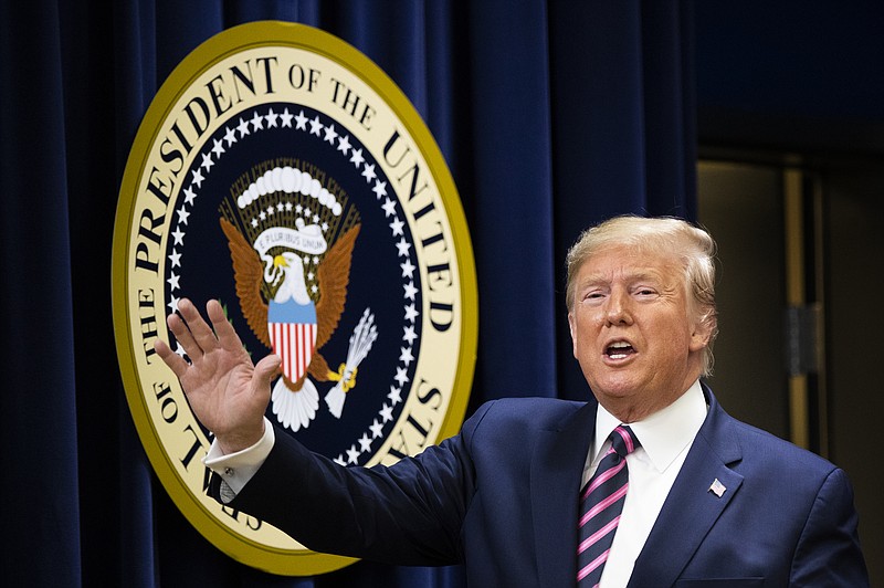 President Donald Trump waves during a summit on transforming mental health treatment to combat homelessness, violence, and substance abuse, at the he Eisenhower Executive Office Building on the White House complex in Washington, Thursday, Dec. 19, 2019, in Washington. (AP Photo/Manuel Balce Ceneta)