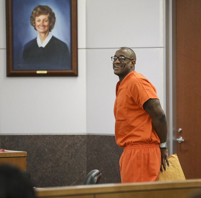 FILE - In this Tuesday, Nov. 26, 2019 file photo, Lydell Grant smiles in court after he was ordered to be released on bond in Houston. On Friday, Dec. 20, 2019, the Harris County District Attorney's Office said that Grant has been cleared in the death of 28-year-old Aaron Scheerhoorn. New evidence has pointed to 41-year-old Jermarico Carter as the killer. Carter was arrested Thursday in Georgia. ( Jon Shapley/Houston Chronicle via AP)