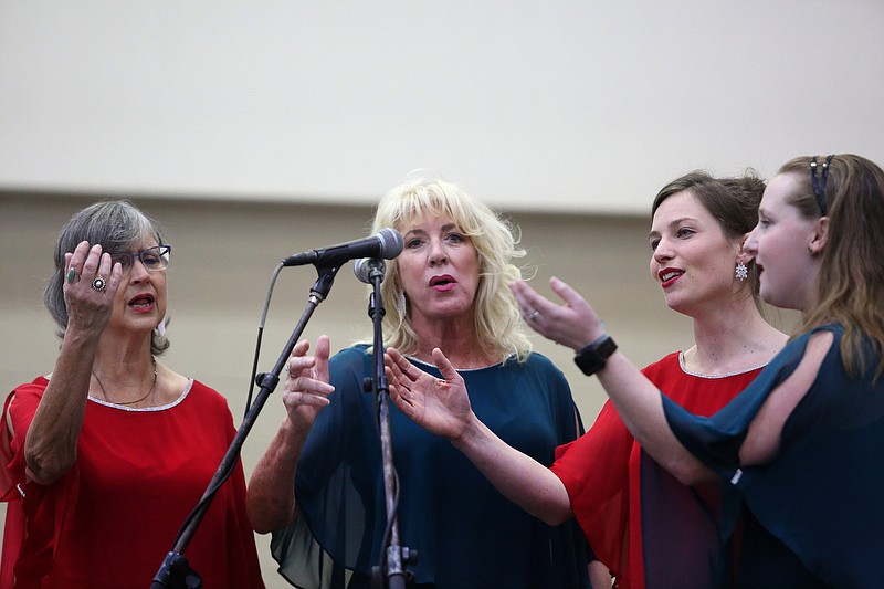 Staff photo by Erin O. Smith / Sue Manthey, Hope Krieg, Greta Jansen and Brittany Sloan of "4 Crying Out Loud!" sing at the last Chattanooga Holiday Market of the year at the Chattanooga Convention Center Sunday, December 22, 2019 in Chattanooga, Tennessee. 