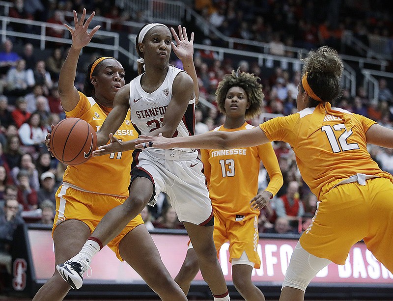 Stanford's Kiana Williams tries to pass while trapped by Tennessee's Kasiyahna Kushkituah, left, Jazmine Massengill (13) and Rae Burrell during the second half of Wednesday's game in Stanford, Calif. The Vols took a lopsided loss that night but cruised to a victory Saturday at Portland State. / AP photo by Ben Margot