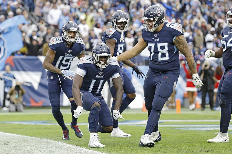 AP Photo/James Kenney / Tennessee Titans wide receiver A.J. Brown (11) celebrates after scoring a touchdown on a 49-yard run against the New Orleans Saints early in Sunday's game in Nashville.