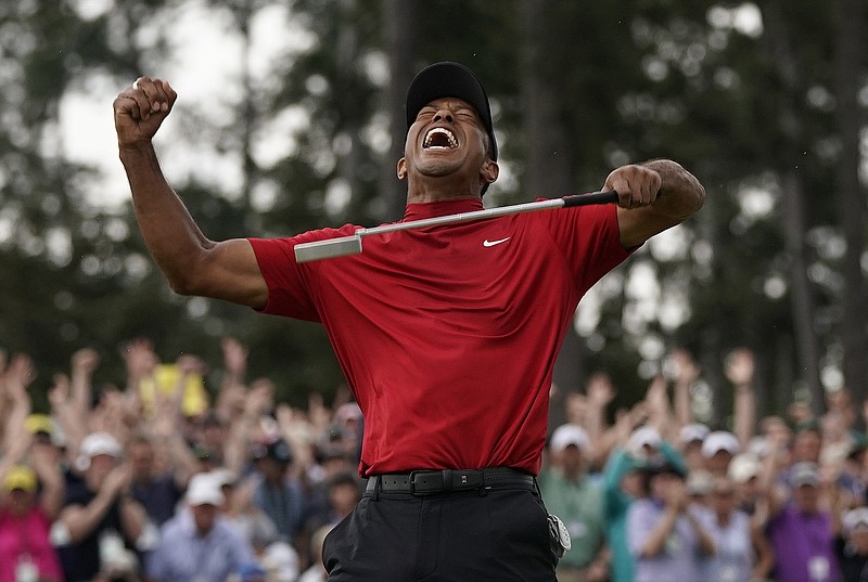Tiger Woods celebrates on April 14 after winning the Masters for the fifth time. The 15th major championship of his dominant career capped a long comeback after struggling off and on the course. Woods' victory was voted the top sports story of 2019 by The Associated Press. / AP photo by David J. Phillip