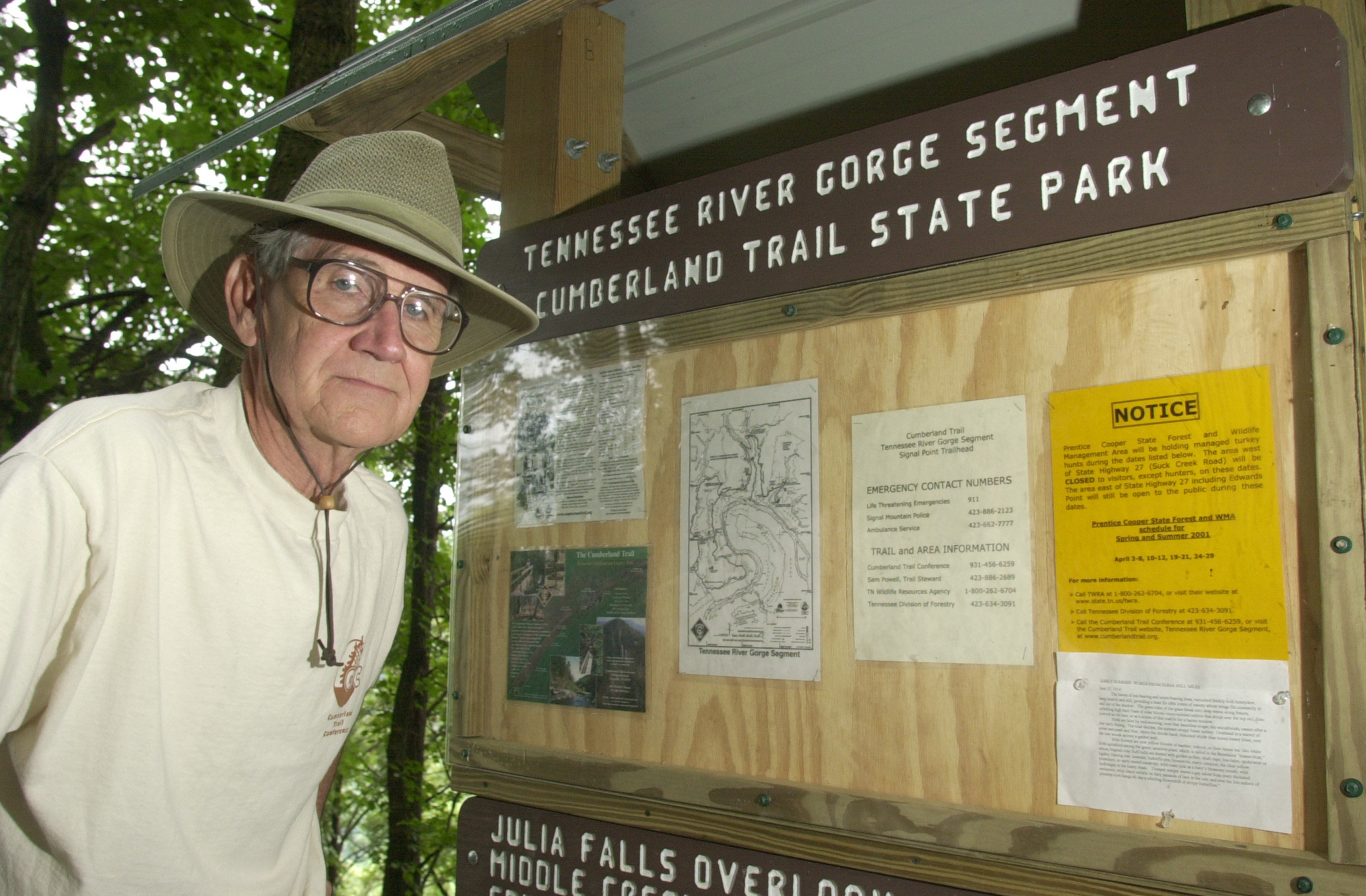 Sam Powell, chairman of the Cumberland Trail Conference, stands at the trail kiosk located at Signal Point. / Staff Photo by Chad McClure