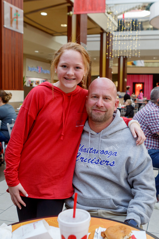 Staff photo by C.B. Schmelter / Terry Wooten, 43, and his 12-year-old stepdaughter Maggie Meadows pose at Hamilton Place Mall on Thursday, Dec. 26, 2019 in Chattanooga, Tenn. Maggie was on the hunt for bargains ahead of a trip to Gatlinburg next week.