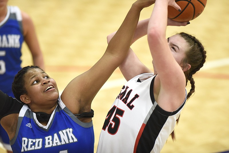 Red Bank's Bailey Lee tries to block a shot by Signal Mountain's Olivia Koontz during the TSSAA District 6-AA tournament title game at Red Bank on Feb. 19. / Staff photo by Robin Rudd