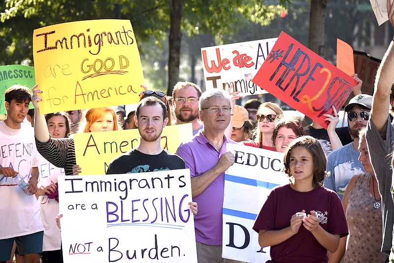 Staff file photo by Robin Rudd / Refugee and immigration supporters listen to a speech by Alondra Gomez outside the Electric Power Board Building in Chattanooga during a 2017 Tennessee Immigrant and Refugee Rights Coalition march.