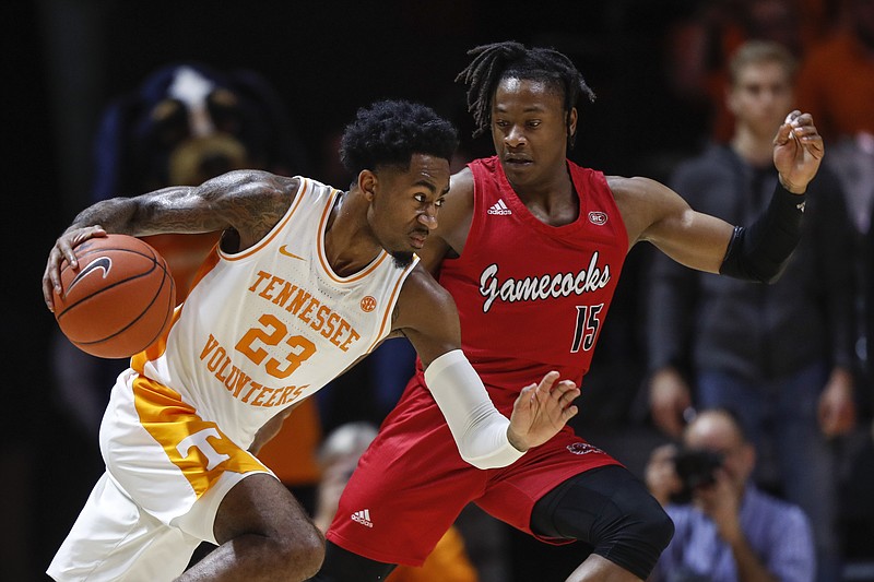 Tennessee guard Jordan Bowden drives past Jacksonville State guard Derek St. Hilaire during the second half of last Saturday's game in Knoxville. The host Vols won 75-53. / AP photo by Wade Payne