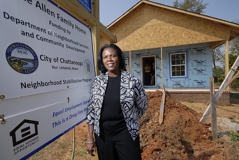 In this 2010 staff file photo, Sandra Gober, manager of the Community Development Division of the city's Department of Economic and Community Development, stands in front of one of 20 newly built houses for low- to moderate-income residents in Chattanooga's Alton Park neighborhood. / Staff file photo by Tim Barber