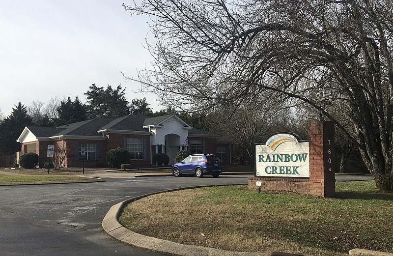 The sign for Rainbow Creek Apartments is seen in this photo. / Staff file photo