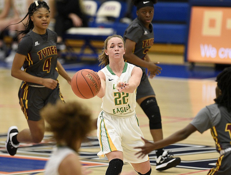 Rhea County's Mallory Hampton, center, passes to Maddie Taylor, left foreground, during a fast break against Tyner in a Chatt-Town Classic game on Friday at Chattanooga State. / Staff photo by Robin Rudd