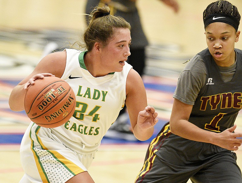 Rhea County's Macy Welch tries to dribble past Tyner's Jermiah McKenzie during a game at Chattanooga State on Friday during the first day of the Chatt-Town Classic. Rhea County beat Tyner 73-31, then beat Red Bank 81-68 on Saturday at the same event. / Staff photo by Robin Rudd