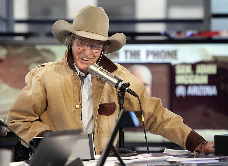 In this Monday, Oct. 5, 2009 file photo,Radio personality Don Imus interviews Sen. John McCain, R-Ariz., by telephone during his debut show on the Fox Business Network in New York. Disc jockey Don Imus, whose career was made and then undone by his acid tongue during a decades-long rise to radio stardom and an abrupt public plunge after a nationally broadcast racial slur, has died, Friday, Dec. 27, 2019. He was 79.(AP Photo/Richard Drew, File)