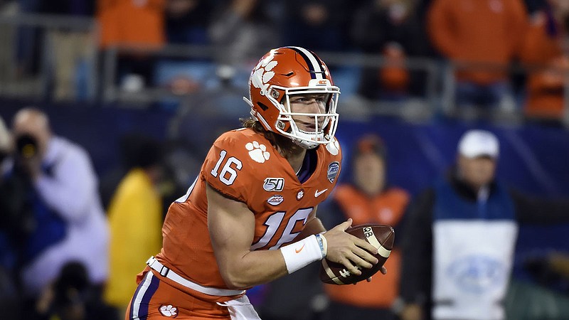 Clemson quarterback Trevor Lawrence scrambles during the first half of the ACC title game against Virginia on Dec. 7 in Charlotte, N.C. / AP photo by Mike McCarn