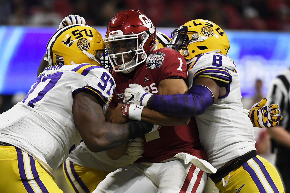 December 28, 2019: LSU's Joe Burrow (9) delivers a pass during the  Chick-Fil-A Peach Bowl - a College Football Playoff Nationall Semifinal -  featuring the Oklahoma Sooners and the LSU Tigers, played