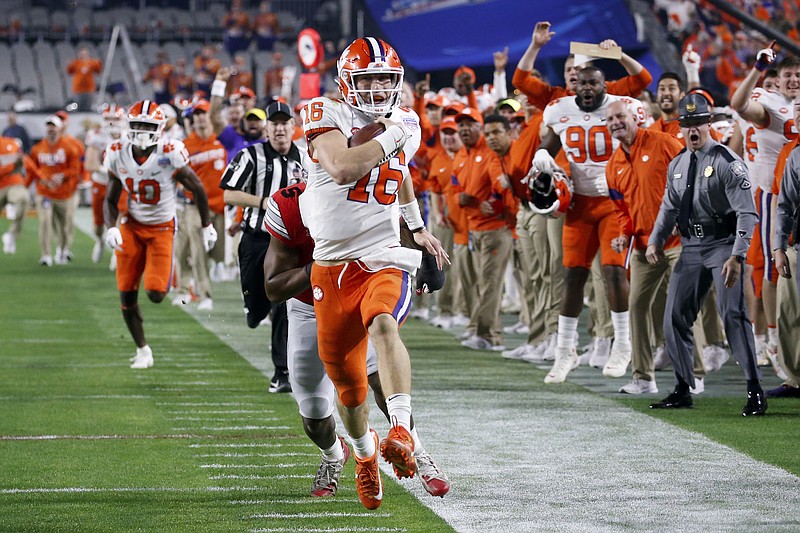 Clemson quarterback Trevor Lawrence completes a 67-yard touchdown run against Ohio State during the first half of the Fiesta Bowl semifinal Saturday in Glendale, Ariz. / AP photo by Ross D. Franklin
