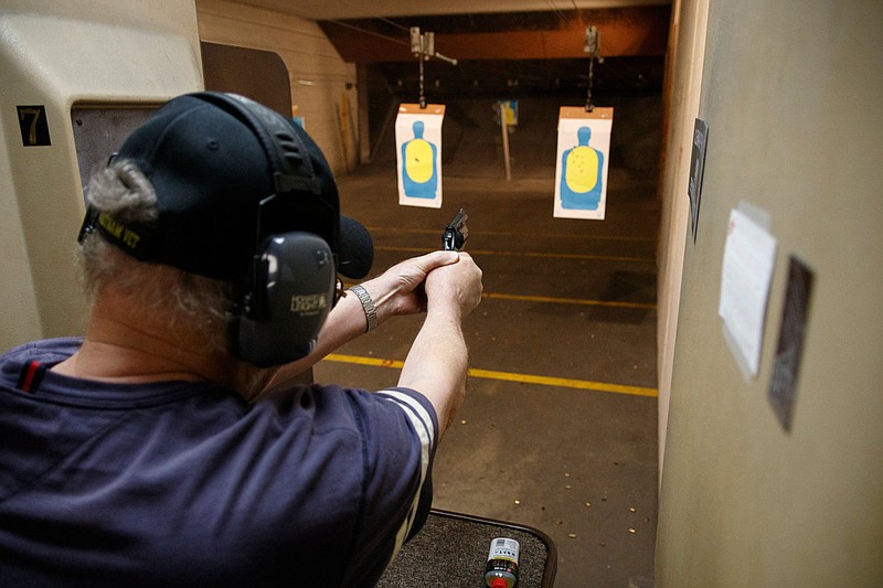 Bobby Ray fires a handgun at the shooting range during a concealed carry permit class at Shooter's Supply on Saturday, May 11, 2019, in Chattanooga, Tenn. The Tennessee legislature has passed a bill that would allow people to carry concealed handguns without going through a carry permit class like the one offered at Shooter's Supply.