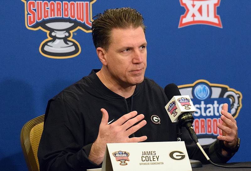 Georgia offensive coordinator and quarterbacks coach James Coley answers a question during a Sugar Bowl news conference Sunday morning in New Orleans. The Bulldogs face Baylor on Wednesday night at the Superdome. / Georgia photo by Steven Colquitt