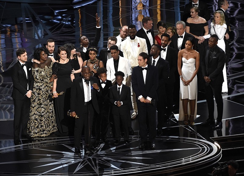 FILE - This Feb. 26, 2017 file photo shows Barry Jenkins and the cast and crew of "Moonlight" accepting the award for best picture at the Oscars in Los Angeles. (Photo by Chris Pizzello/Invision/AP, File)