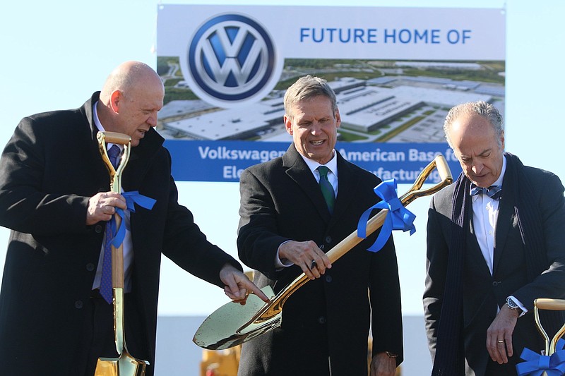 Staff photo by Erin O. Smith / Volkswagen Chattanooga Chief Executive Officer Tom du Plessis, Tennessee Governor Bill Lee and Volkswagen senior executive vice president of public affairs David Geanacopoulos sign their shovels during the groundbreaking event for the Volkswagen electric vehicle facility at the Volkswagen plant Wednesday, November 13, 2019 in Chattanooga, Tennessee.