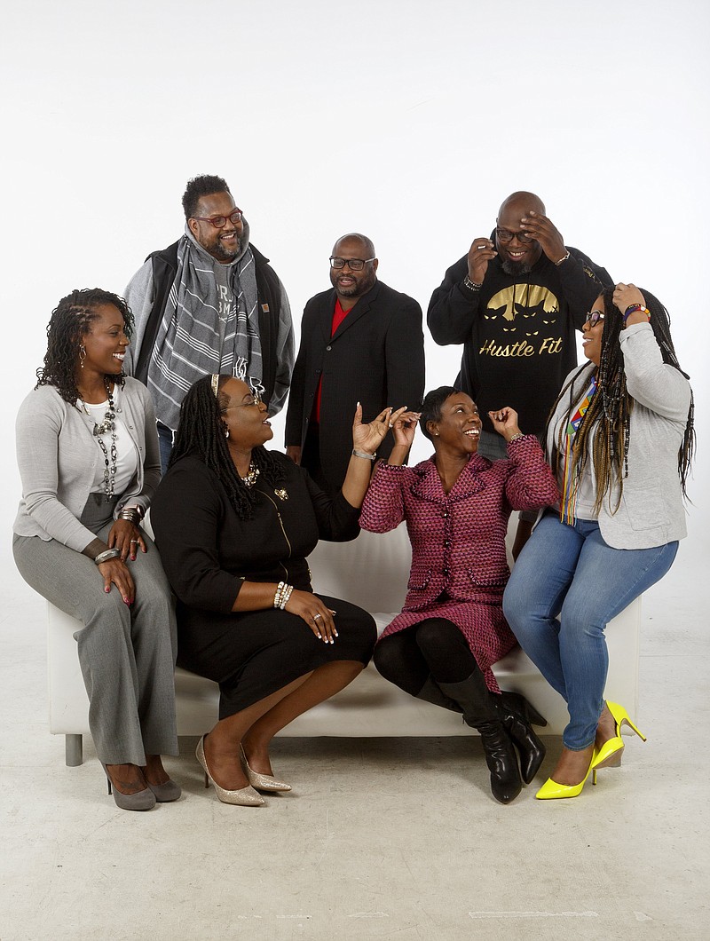  Staff photo by C.B. Schmelter / Members of Sankofa joke during a photo shoot in the studio at the Times Free Press on Monday, Dec. 2, 2019 in Chattanooga, Tenn. They are (sitting from left-to-right) Comelia Franceschi, Lakweshia Ewing, Karitsa Jones, Carmen Davis, (standing from left-to-right) James McKissic, William Jones and Shane Morrow. Not pictured are members Gabriel Franceschi, Wade Hinton, Shawanna Kendrick, Chantelle Respert, Chad Suttles and Rebecca Suttles.