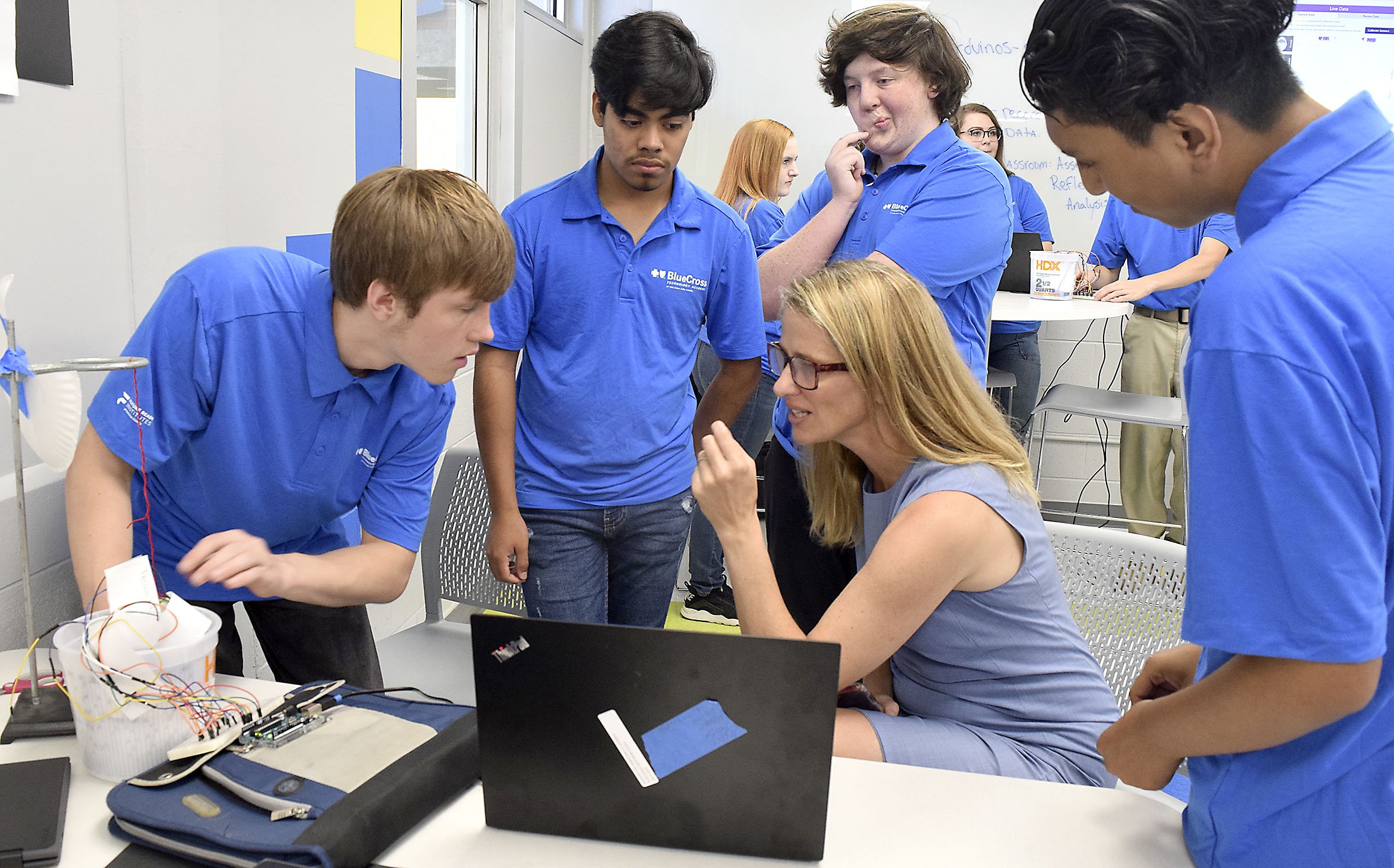 Staff Photo by Robin Rudd/ Allyson Knox, of Microsoft, discusses a experiment dealing with brain impulses with, from left, Red Bank sophomores Aedan Lane, Alex Santllan, Canyon Mercer and Matthew Cruz. Congressman Chuck Fleischmann and other officials toured the Future Ready classroom at Red Bank High school to view the implementation of successful computer science literacy programs on September 6, 2019. Earlier in the day there was also a tour of programs at Girls Leadership Academy and later a roundtable discussion at the Edney Innovation Center.