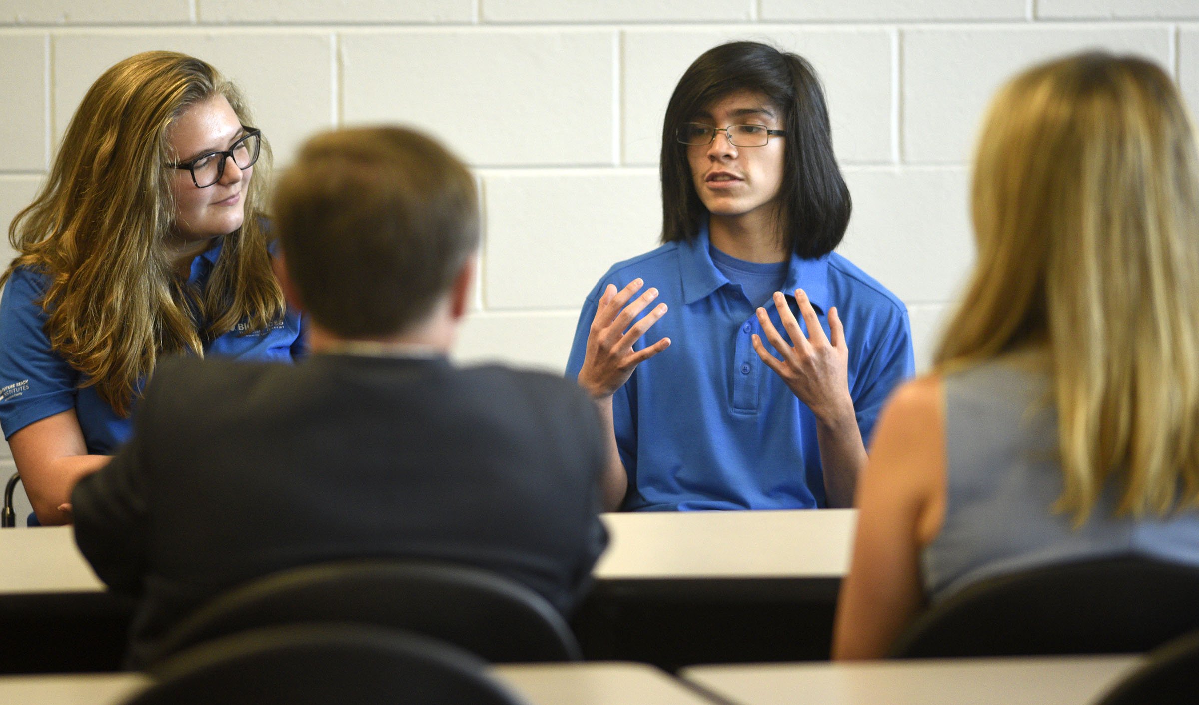 Staff Photo by Robin Rudd/ Red Bank High School sophomore Cristian Mendez, right, talks about the importance of technical training while fellow sophomore Lily Akins looks on. Congressman Chuck Fleischmann and other officials toured the Future Ready classroom at Red Bank High school to view the implementation of successful computer science literacy programs on September 6, 2019. Earlier in the day there was also a tour of programs at Girls Leadership Academy and later a roundtable discussion at the Edney Innovation Center.