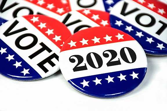 Close up of political voting pins for 2020 election on white. / Photo by Getty Images/iStockphoto/liveslow