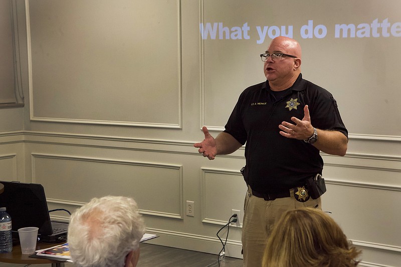 Staff File Photo By Wyatt Massey / Lt. Eric Merkle of the Hamilton County Sheriff's Department leads an active shooter training at Mizpah Congregation in August.