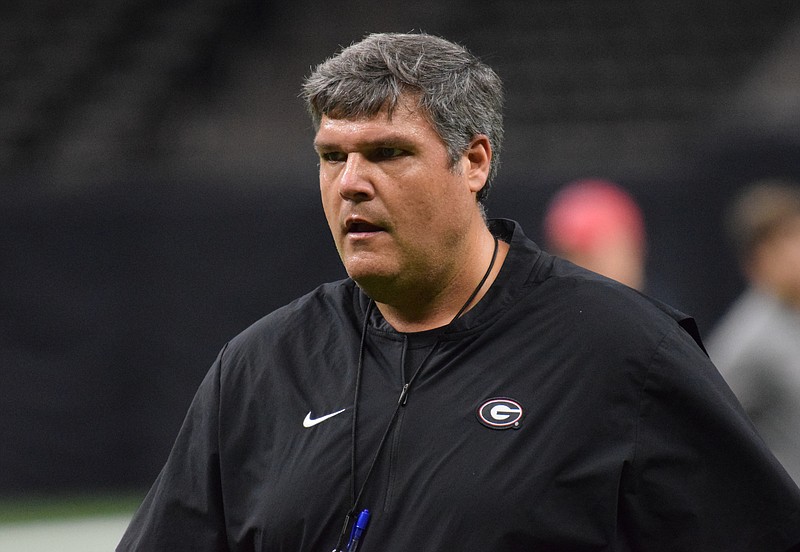 Former Ole Miss head coach and new Georgia offensive line coach Matt Luke watches the Bulldogs practice this past weekend inside the Superdome in preparation for Wednesday night's Sugar Bowl against Baylor.