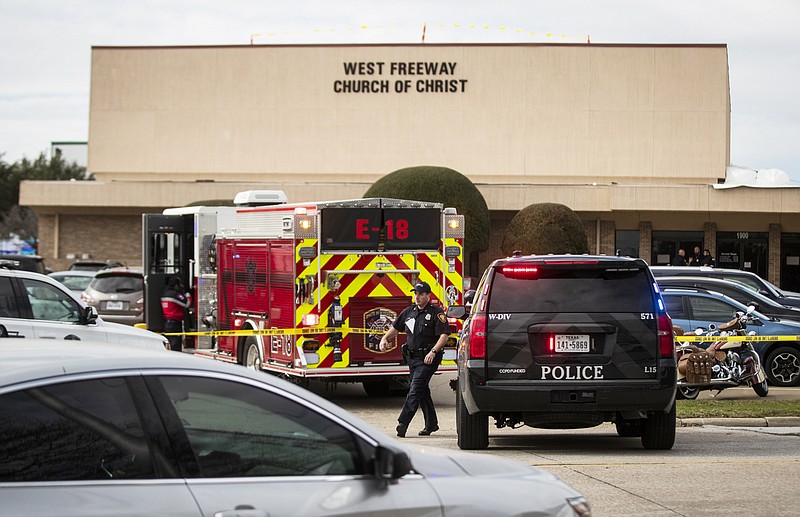 Police and fire departments surround the scene of a shooting at West Freeway Church of Christ in White Settlement, Texas, Sunday, Dec. 29, 2019. (Yffy Yossifor/Star-Telegram via AP)