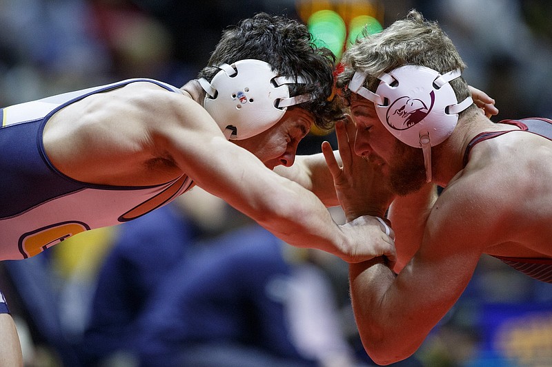 UTC's Chris Debien, left, wrestles Lock Haven's Kyle Shoop during the 141-pound fifth-place bout during the Southern Scuffle tournament at McKenzie Arena on the campus of the University of Tennessee at Chattanooga on Wednesday, Jan. 2, 2019, in Chattanooga, Tenn. / Staff photo by C.B. Schmelter