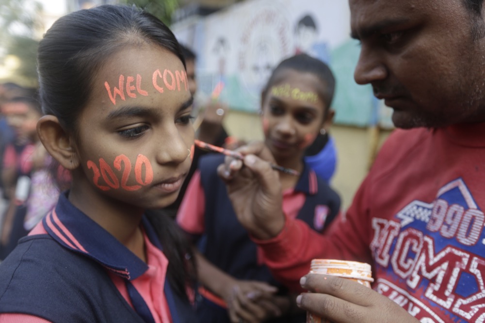 An Indian student gets her face painted during an event to welcome the New Year in Ahmadabad, India, Tuesday, Dec. 31, 2019. (AP Photo/Ajit Solanki)