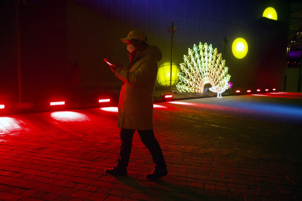 A man walks near a light sculpture before a New Year’s Eve countdown event at the 2022 Beijing Winter Olympic headquarters in Bejiing, Tuesday, Dec. 31, 2019. Revelers around the globe are bidding farewell to a decade that will be remembered for the rise of social media, the Arab Spring, the #MeToo movement and, of course, President Donald Trump. (AP Photo/Ng Han Guan)